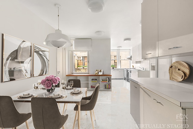 dining area featuring sink