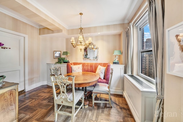 dining space with crown molding, dark parquet floors, breakfast area, and a chandelier