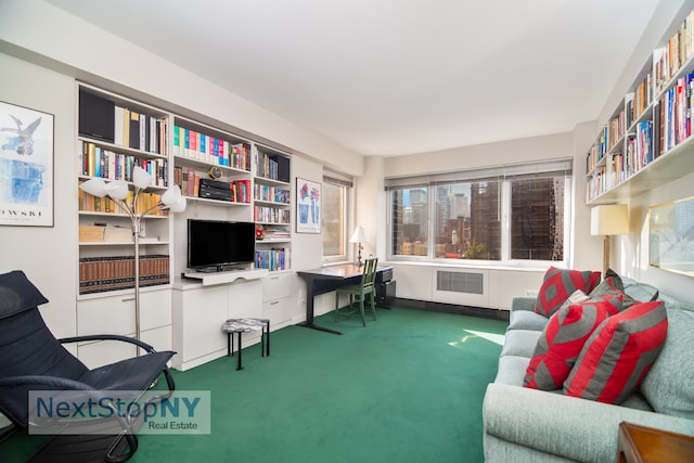 living area with radiator and carpet flooring