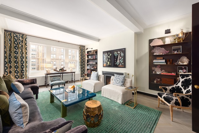 living room with light parquet flooring, a fireplace, and beamed ceiling