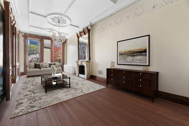 interior space with dark hardwood / wood-style floors, a notable chandelier, and crown molding