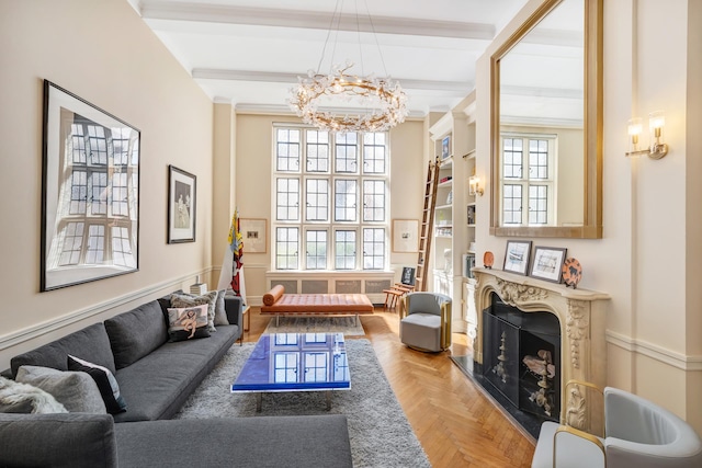 living room with an inviting chandelier, parquet floors, a premium fireplace, and beam ceiling