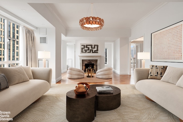 living room featuring wood-type flooring, crown molding, and a chandelier