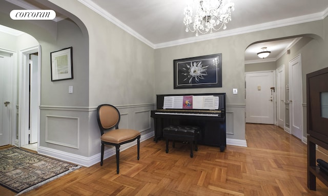 misc room with crown molding, light parquet flooring, and a chandelier