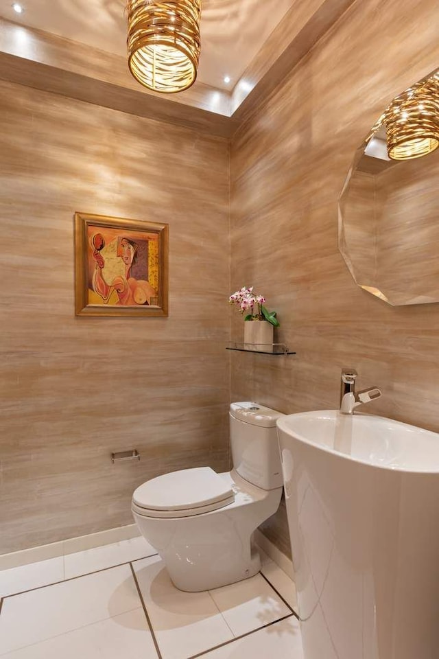 bathroom featuring tile patterned flooring and toilet