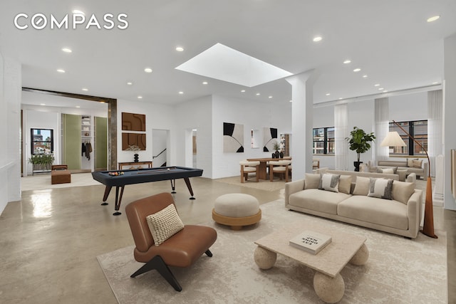 living room with a skylight and plenty of natural light