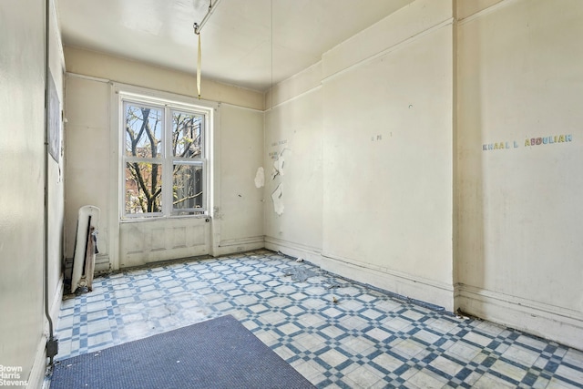 empty room with tile floors