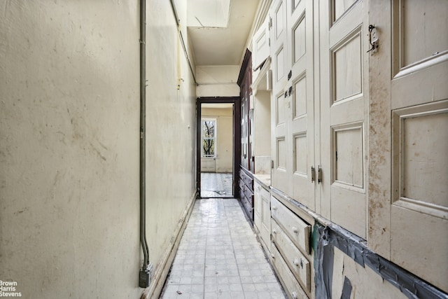 corridor with light tile floors