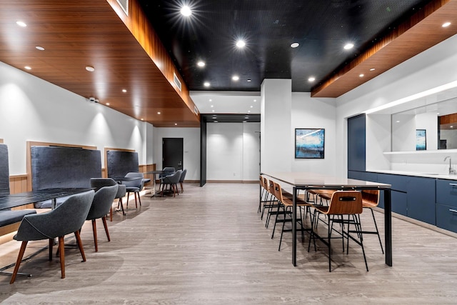 dining space featuring light hardwood / wood-style floors and sink