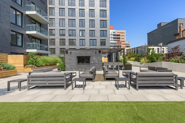 view of patio / terrace with a balcony and an outdoor hangout area