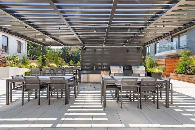 view of patio with a pergola, area for grilling, grilling area, and sink