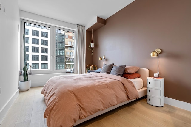 bedroom with light hardwood / wood-style flooring