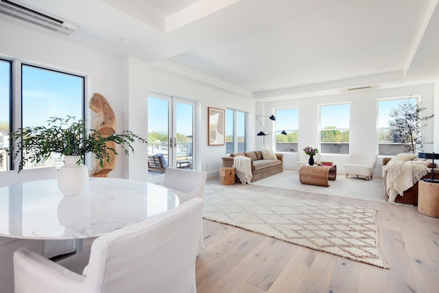 interior space with a wall mounted AC and light wood-type flooring