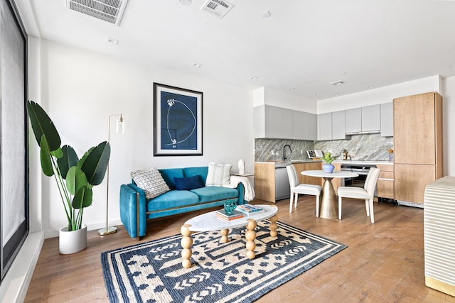 living room with light hardwood / wood-style flooring