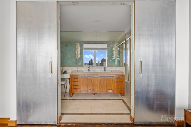 bathroom featuring vanity and tile floors