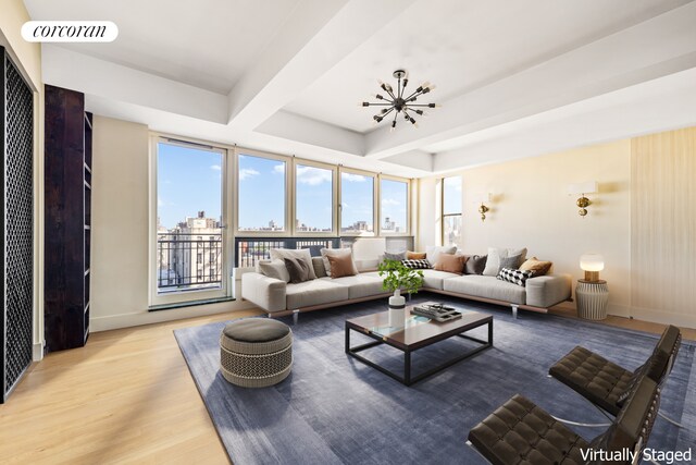 living room with beamed ceiling and light hardwood / wood-style floors