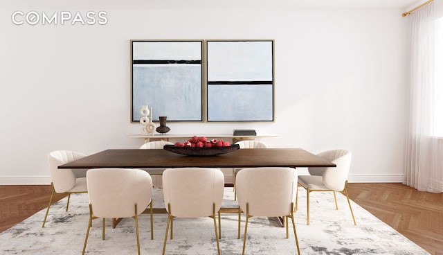 dining area featuring light parquet flooring