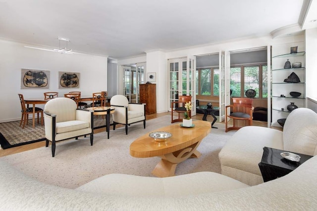 living room featuring crown molding