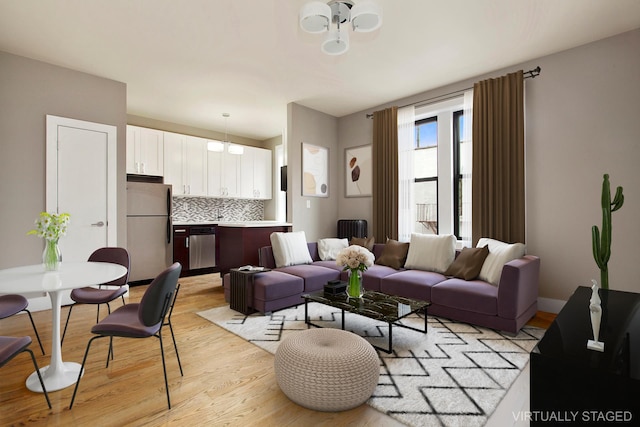 living room with light hardwood / wood-style flooring