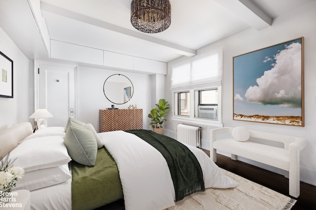 carpeted home office with ceiling fan and radiator