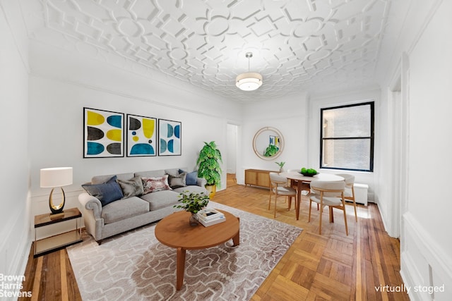 living room featuring light parquet floors and a textured ceiling