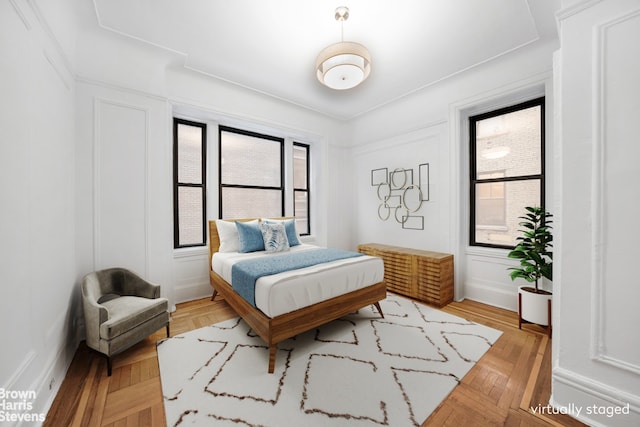 bedroom with light parquet floors