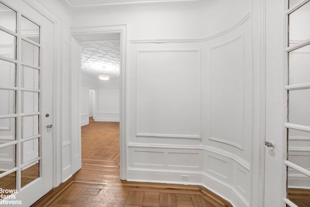 walk in closet featuring parquet floors