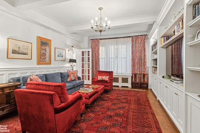 living room featuring beamed ceiling, dark parquet floors, crown molding, and a notable chandelier