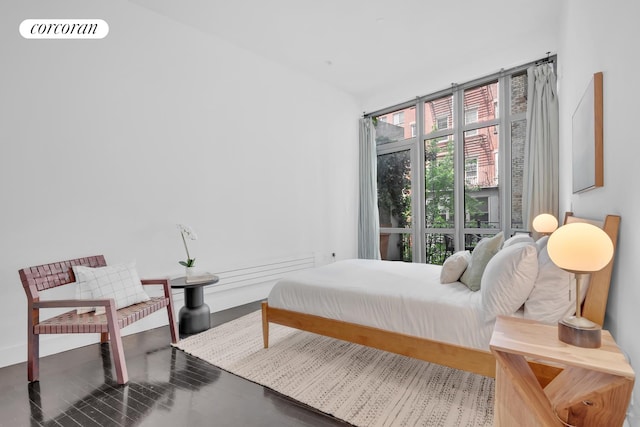 bedroom with hardwood / wood-style flooring