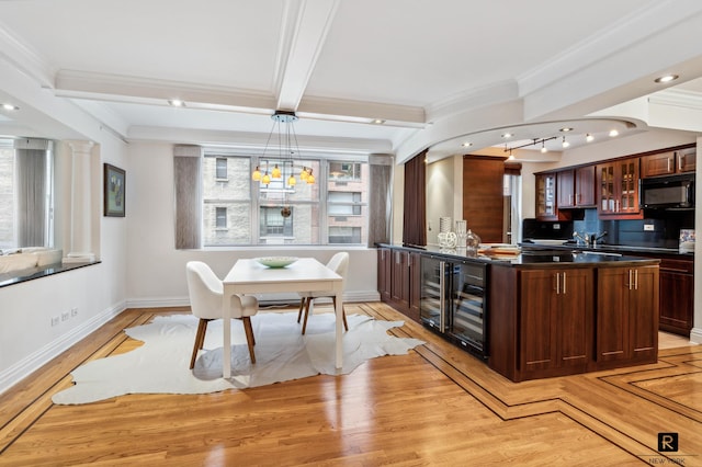 kitchen with beam ceiling, crown molding, light wood-type flooring, beverage cooler, and hanging light fixtures