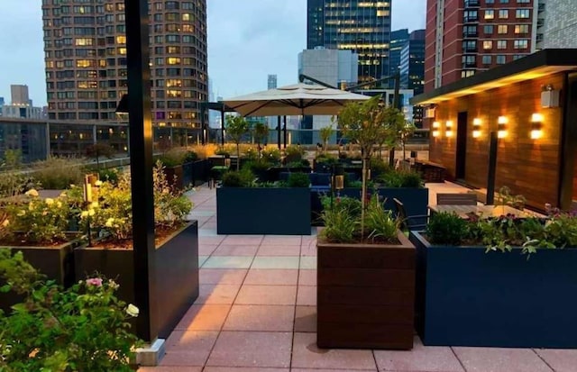 view of patio terrace at dusk