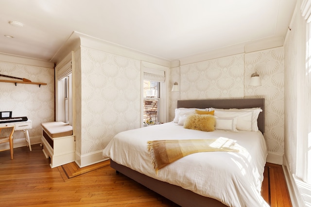 bedroom featuring hardwood / wood-style floors and ornamental molding