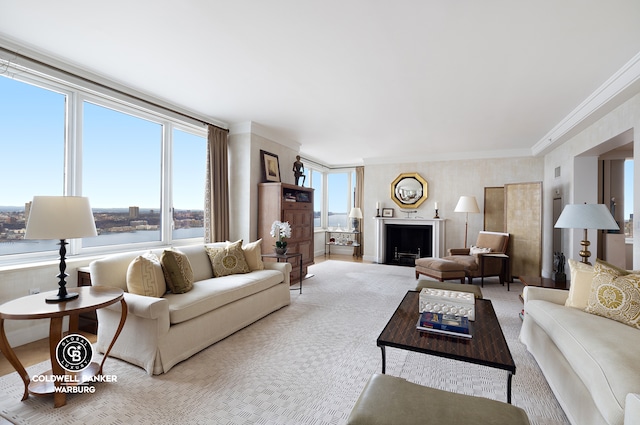 living room featuring carpet flooring, a healthy amount of sunlight, and crown molding