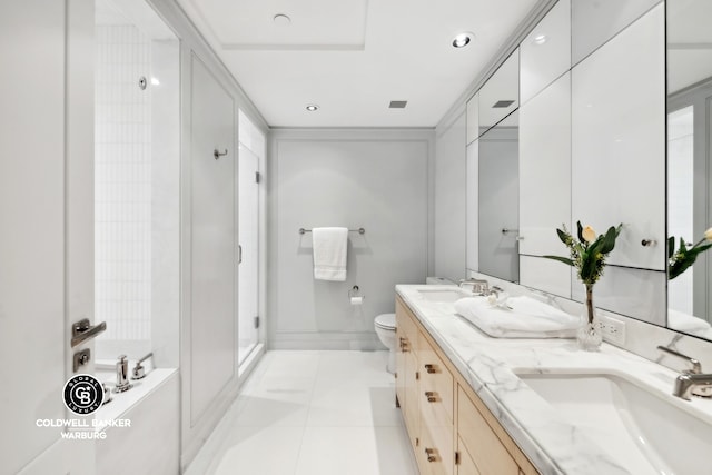 bathroom featuring dual vanity, tile patterned floors, and toilet