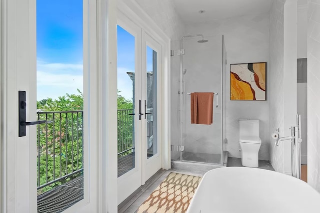 bathroom with tile walls and toilet