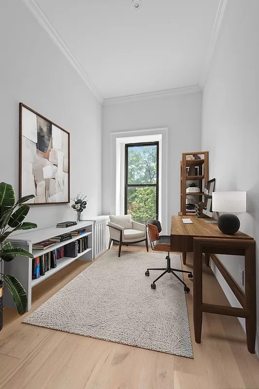 office featuring wood-type flooring and crown molding