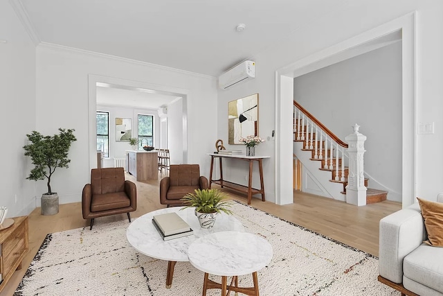 living room with ornamental molding, a wall mounted air conditioner, and wood-type flooring