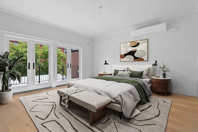 bedroom with light hardwood / wood-style flooring, a wall mounted AC, french doors, access to outside, and crown molding