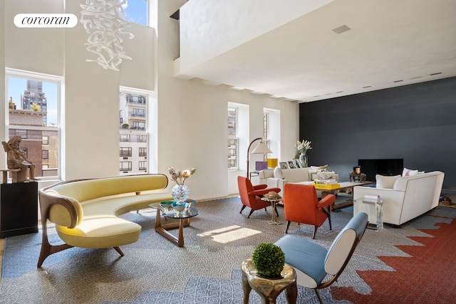 living room with a high ceiling