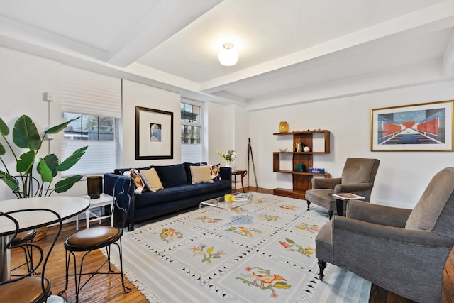 living room with hardwood / wood-style floors and beamed ceiling