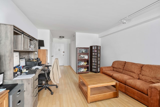 office area featuring light hardwood / wood-style floors and rail lighting