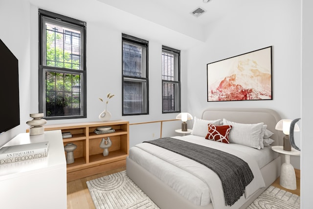 bedroom with light wood-type flooring