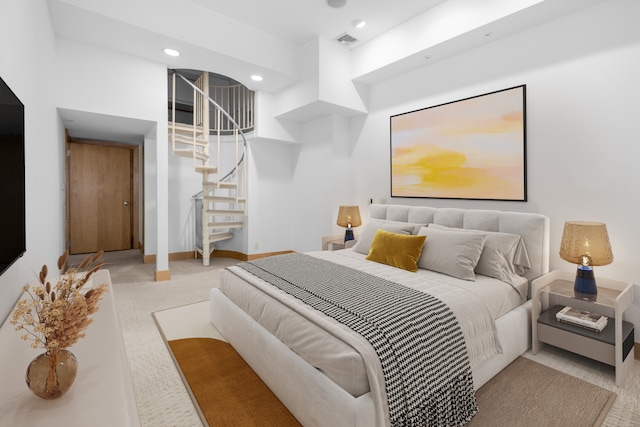 bedroom with light colored carpet