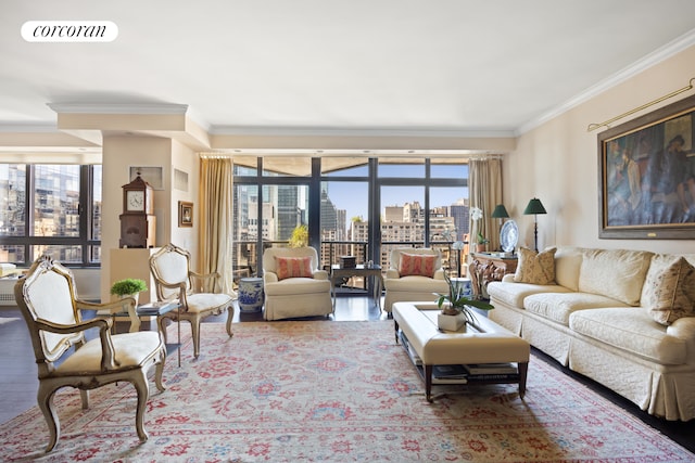 living room with hardwood / wood-style floors, plenty of natural light, and crown molding