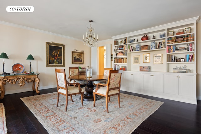 dining space featuring dark hardwood / wood-style floors, a chandelier, and ornamental molding