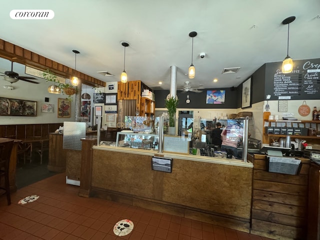 kitchen with ceiling fan and tile patterned floors