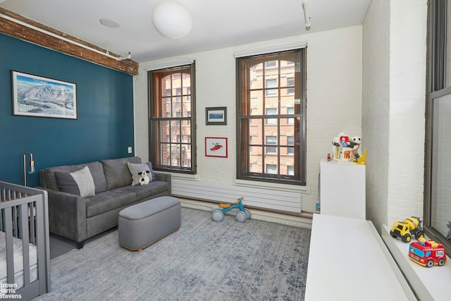 bedroom featuring a nursery area