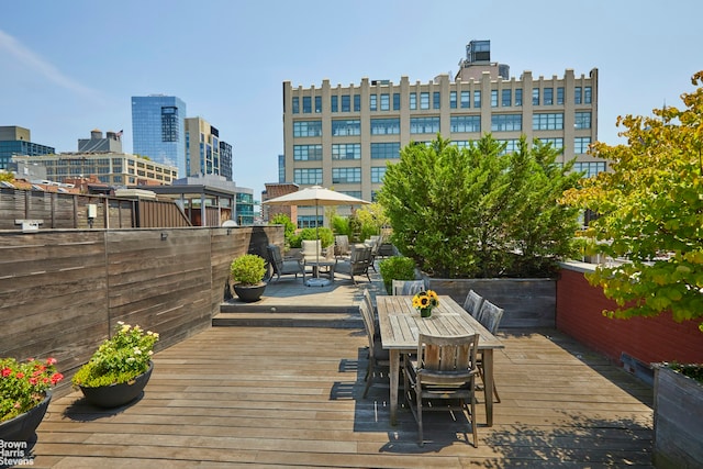 wooden terrace featuring an outdoor living space