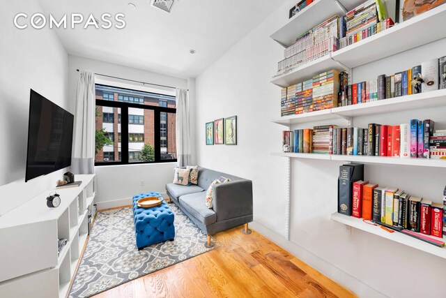 sitting room featuring hardwood / wood-style flooring