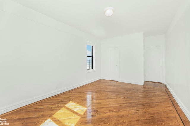 empty room featuring hardwood / wood-style flooring